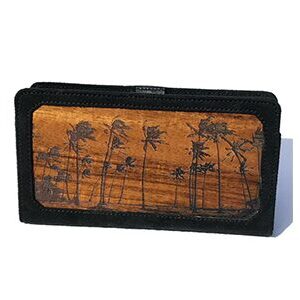A wooden wallet with palm trees on it.