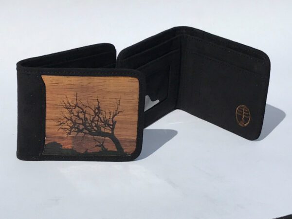 A wooden wallet with an image of a tree.